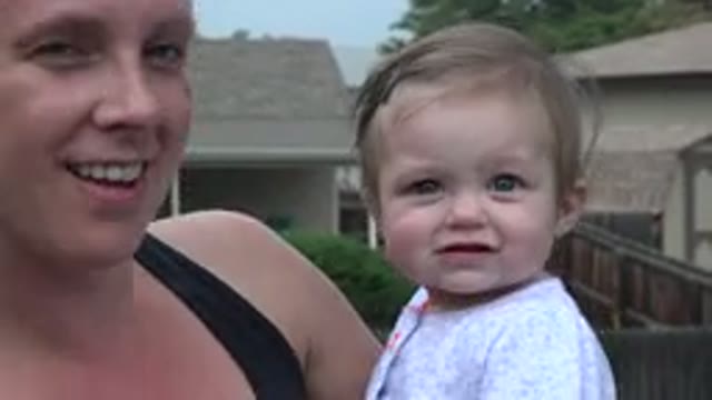 WESTMINSTER COLORADO-2015: Mother Holding Toddler and Waving at Camera