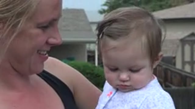 WESTMINSTER COLORADO-2015: Mother and Baby Daughter Share Shy Camera Moment