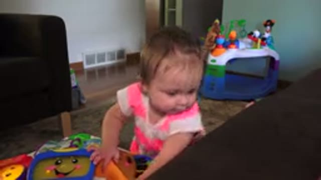 WESTMINSTER COLORADO-2015: Cute Little Toddler Standing By The Couch And Playing