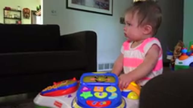 WESTMINSTER COLORADO-2015: A Child Playing With Toys In A Room With Pictures