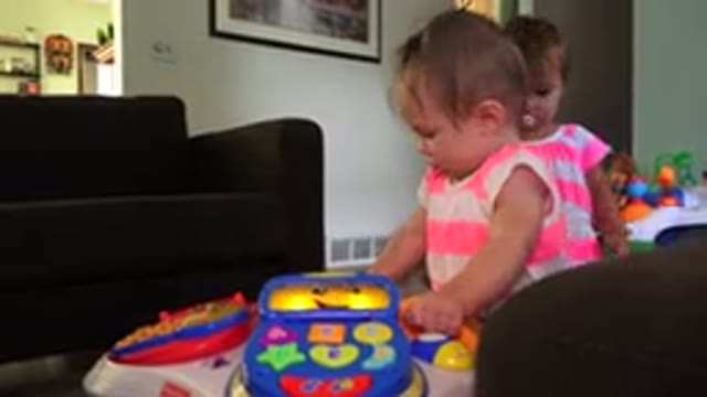 WESTMINSTER COLORADO-2015: Two Babies Playing With Toys In A House