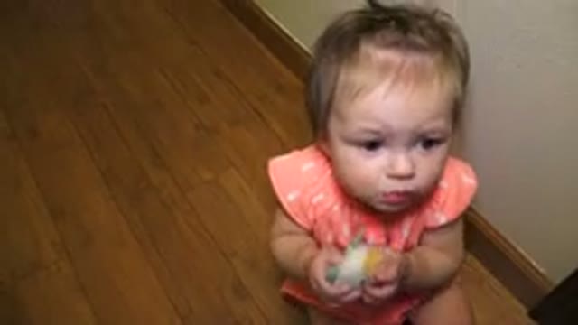 BROOMFIELD COLORADO-2015: Baby Girl Playing With Teething Toy And Sitting On Floor