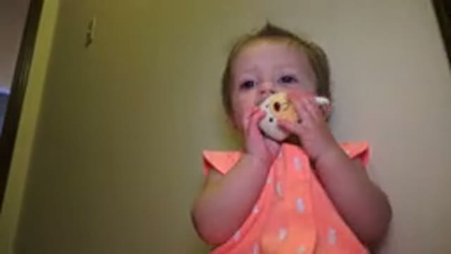 BROOMFIELD COLORADO-2015: Baby Looking Around And Chewing On Toy