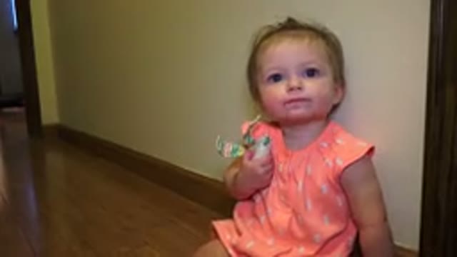 BROOMFIELD COLORADO-2015: Adorable Baby Girl Playing With Toy and Laughing