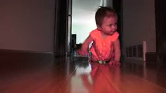 BROOMFIELD COLORADO-2015: Blond Baby Wearing Pink Crawling Towards Camera In