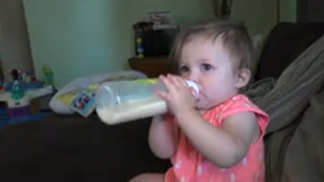 BROOMFIELD COLORADO-2015: Baby Drinking Milk Or Formula On A Couch