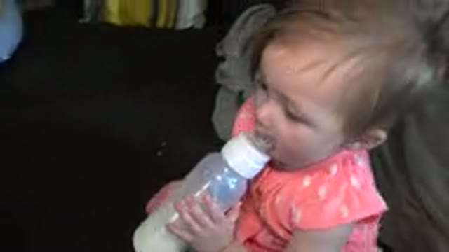 BROOMFIELD COLORADO-2015: Cute Blond Baby Girl Enjoying Her Bottle