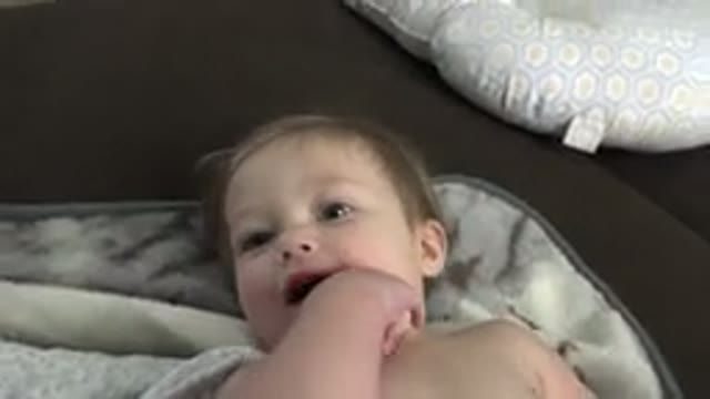 WESTMINSTER COLORADO-2015: A Baby With Blonde Hair Laying On A Blanket With