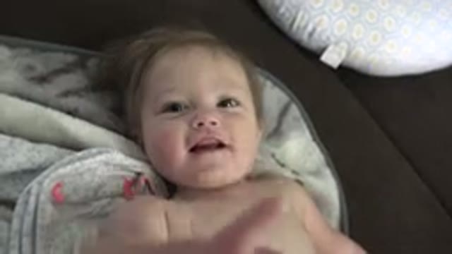 WESTMINSTER COLORADO-2015: Cute Toddler Lying Down and Chewing Stuffed Bear