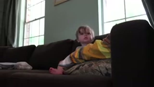 WESTMINSTER COLORADO-2015: A Child Trying To Get Down From A Black Couch