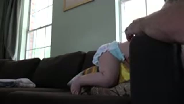 WESTMINSTER COLORADO-2015: A Child Climbs Over a Brown Sofa Into the