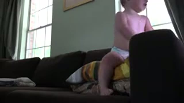WESTMINSTER COLORADO-2015: A Child Playing On A Couch Being Supervised By An