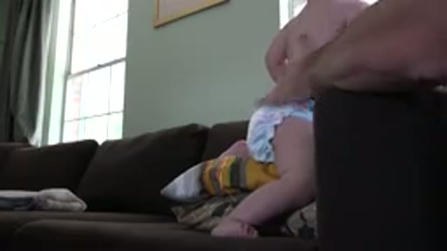 WESTMINSTER COLORADO-2015: Baby In Diaper Stands On Couch And Is Caressed By An