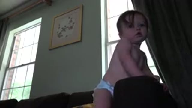 WESTMINSTER COLORADO-2015: Cute Little Toddler Playing On The Couch In A Living Area