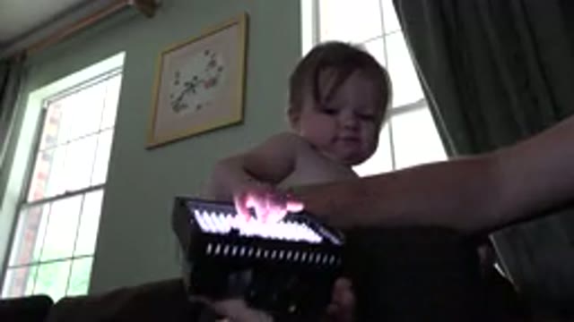 WESTMINSTER COLORADO-2015: Dad Playing With Baby In House With Warm Light