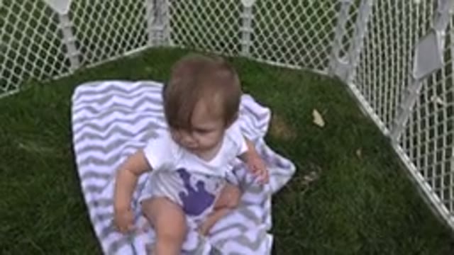 WESTMINSTER COLORADO-2015: Baby Chewing On Finger While Sitting On Blanket On