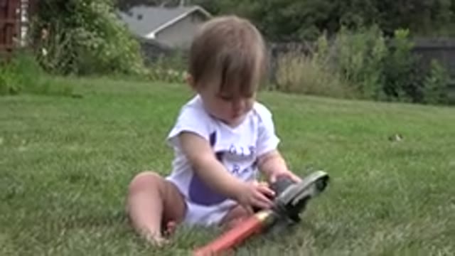 WESTMINSTER COLORADO-2015: Baby Sitting In A Yard On A Sunny Day And Playing