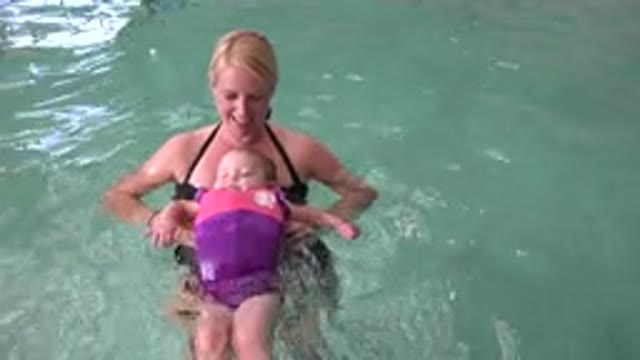 WESTMINSTER COLORADO-2015: Mother Assisting Her Newborn to Float in a Pool