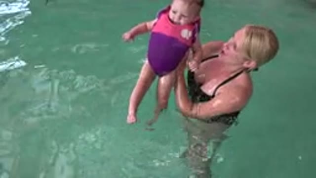 WESTMINSTER COLORADO-2015: Mother Swims With Her Baby In The Pool