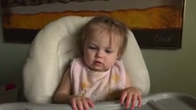 HIDDEN LAKE COLORADO-2015: Baby Girl With Pink Bib Playing With Her Parents At A