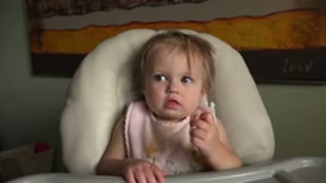 HIDDEN LAKE COLORADO-2015: A Baby Sitting In A Chair And Looking Around The Room