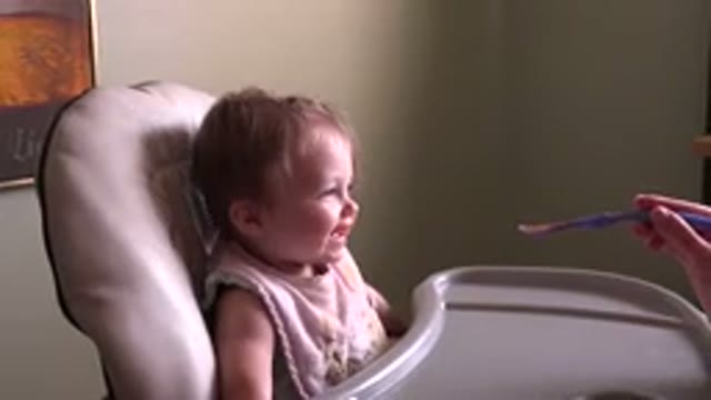 HIDDEN LAKE COLORADO-2015: Person With Spoon To Feed Baby Who Laughs Every Time