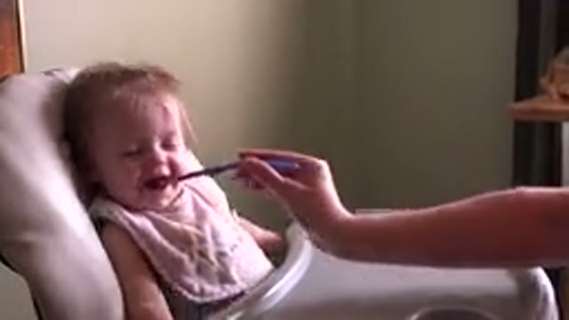 HIDDEN LAKE COLORADO-2015: Baby Having A Good Time Eating Baby Food And Laughing