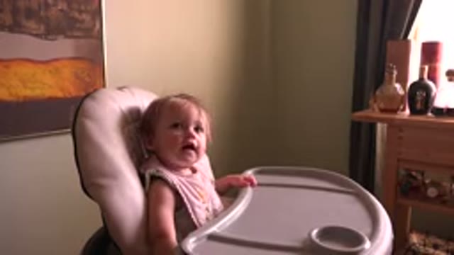HIDDEN LAKE COLORADO-2015: Baby Girl Laughing While Talking With Parent And
