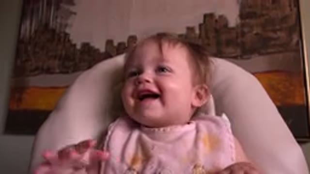 HIDDEN LAKE COLORADO-2015: Cute Little Baby Sitting On A Chair And Having A Good Laugh