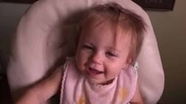 HIDDEN LAKE COLORADO-2015: A Little Baby Girl With Blue Eyes Laughing While She