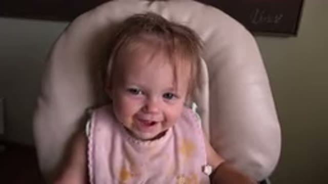 HIDDEN LAKE COLORADO-2015: Baby Sits In Highchair And Plays With Plastic Toys
