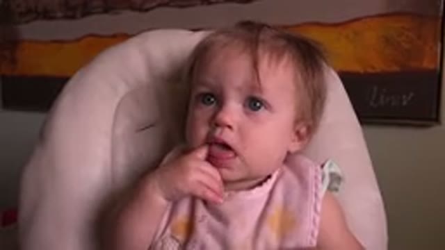 HIDDEN LAKE COLORADO-2015: Baby With Blue Eyes Chewing Finger Sitting In Chair
