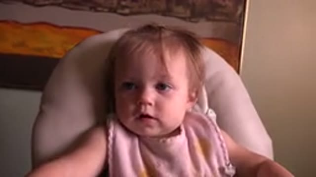 HIDDEN LAKE COLORADO-2015: A Sweet Baby With Blue Eyes Sitting On A Chair