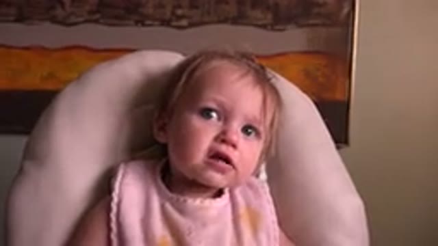 HIDDEN LAKE COLORADO-2015: Small Human Child Raising Arms in Feeding Chair