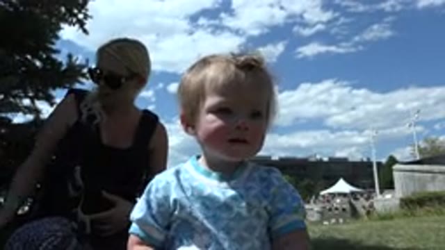 DENVER COLORADO-2015: Female Toddler Enjoying Sunny Day at the Park with Mother