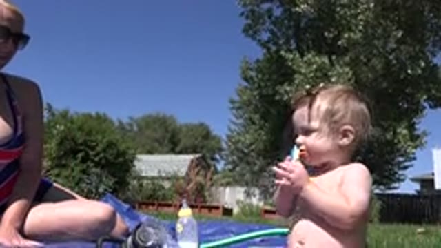 WESTMINSTER COLORADO-2015: Child Has Fun Playing With His Mother During A Summer