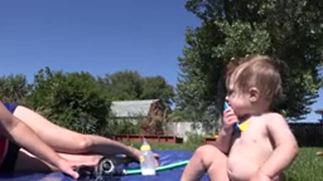 WESTMINSTER COLORADO-2015: Baby Sitting In Garden With Parent Outside Chewing