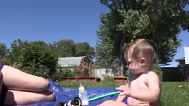 WESTMINSTER COLORADO-2015: Mother And Son Playing In The Swimming Pool During A