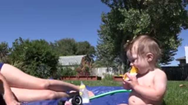 WESTMINSTER COLORADO-2015: Toddler Chews On Blue Toy Boat On A Sunny Day