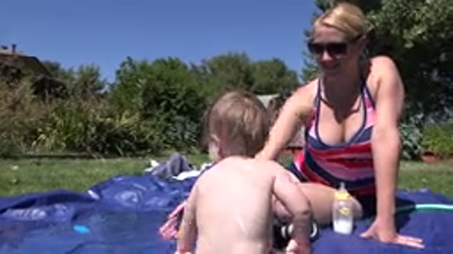 WESTMINSTER COLORADO-2015: Mom And Daughter Sitting In A Yard With A Pool