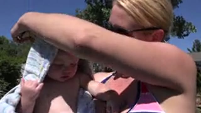 WESTMINSTER COLORADO-2015: A Woman And Her Child Laughing Outside