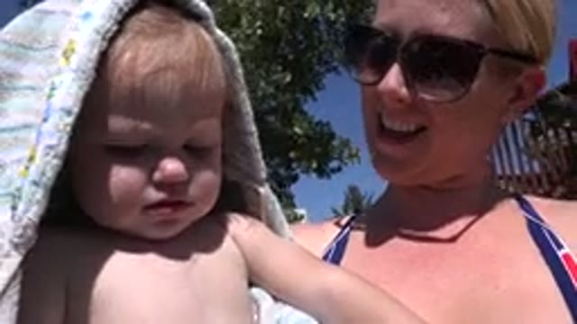 WESTMINSTER COLORADO-2015: Mother Playing With Her Baby On A Sunny Day