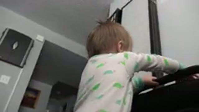 WESTMINSTER COLORADO-2015: Small Female Child Tries Climbing On Top Of Object