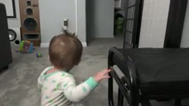 WESTMINSTER COLORADO-2015: Infant Wearing Green And White Sleeper Crawls On Carpet