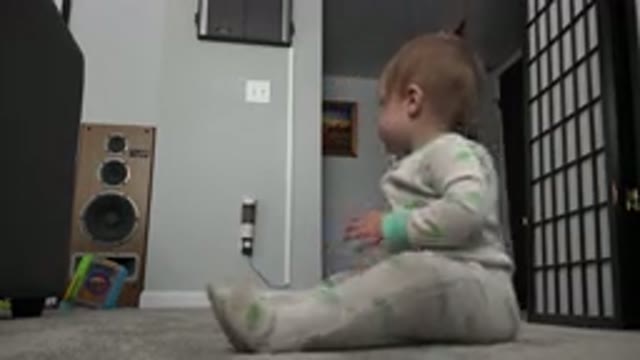 WESTMINSTER COLORADO-2015: Blonde Baby in Pajamas Playing with Toys on Carpet