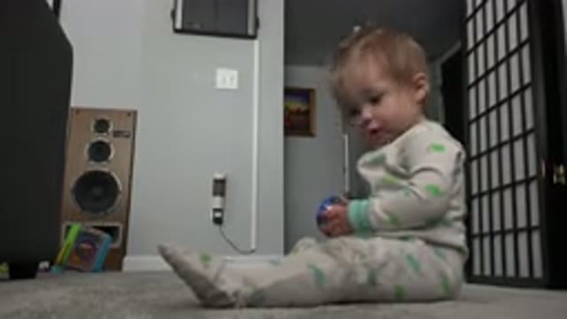 WESTMINSTER COLORADO-2015: Child Dressed In Overalls Playing Sitting Next To The