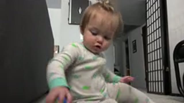 WESTMINSTER COLORADO-2015: A Cute Little Toddler Sitting On The Floor And Playing With A Toy