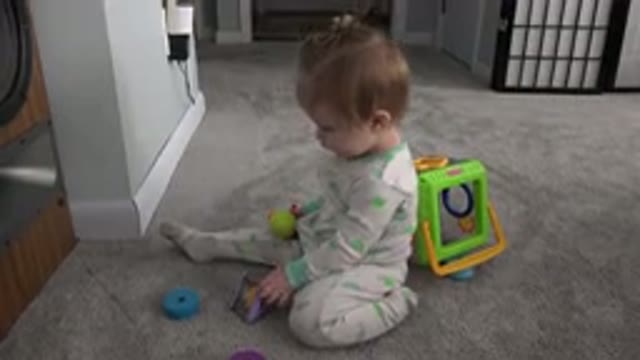 WESTMINSTER COLORADO-2015: Baby Girl Sitting in a House and Playing with Toys