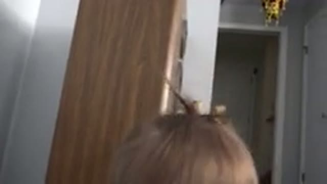 WESTMINSTER COLORADO-2015: Baby Girl Climbing Down From a Small Speaker in Home