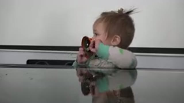 WESTMINSTER COLORADO-2015: Baby Explores New Instrument With Hands Fingers And Mouth